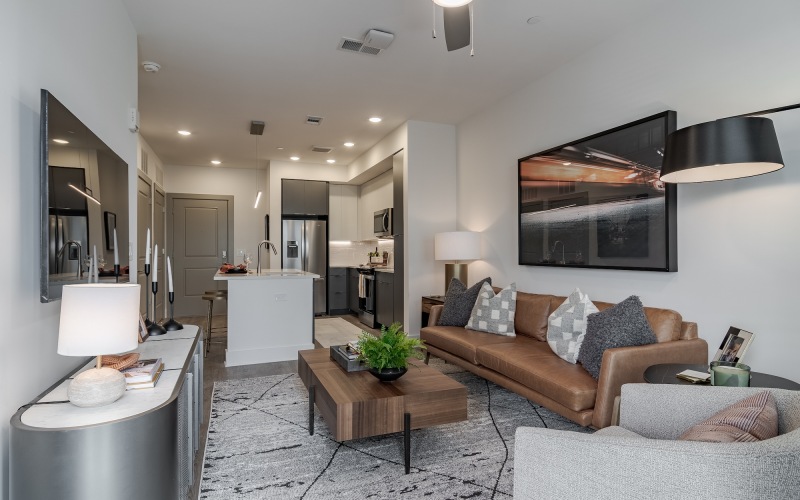 a living room with a couch and chairs